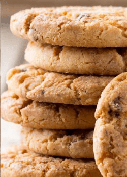 Stacked chocolate chip cookies from the biscuit manufacturing agri-food sector.