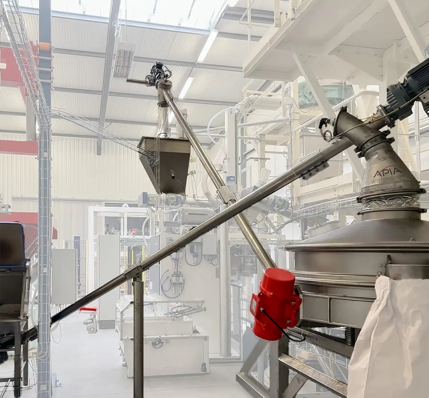 Alimentation et reprise sous tamiseur de sécurité installé entre la videuse big-bags et l'ensacheuse